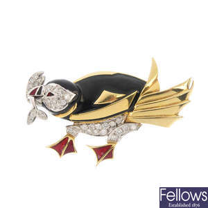 An 18ct gold diamond and enamel puffin brooch.