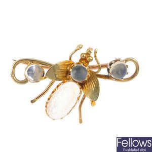 A moonstone fly brooch.