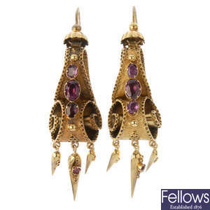 A pair of gold foil-back garnet ear pendants.