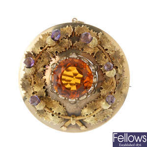 A citrine and amethyst thistle brooch.