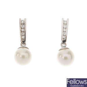 A pair of 18ct gold diamond and cultured pearl ear pendants. 