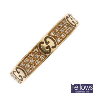 GUCCI - an 18ct gold diamond band ring.