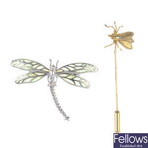 An insect stick pin and brooch.