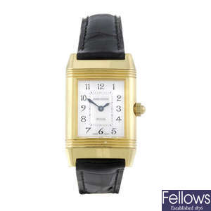 JAEGER-LECOULTRE - a lady's 18ct yellow gold Reverso Duetto wrist watch.