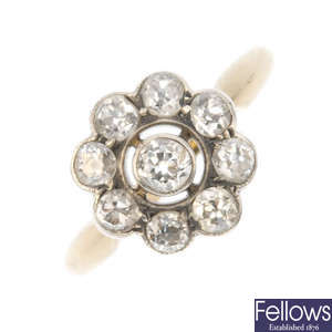A platinum and 18ct gold diamond cluster ring.