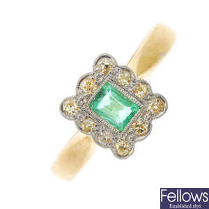 A 22ct gold emerald and diamond cluster ring.