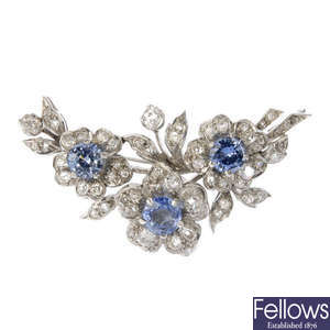 A mid 20th century sapphire and diamond floral spray brooch.