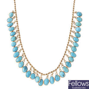 A turquoise fringe necklace. 