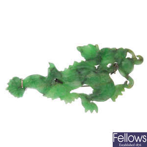 A jade dragon brooch.