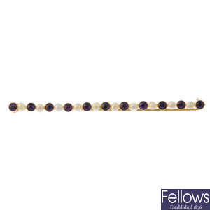 An early 20th century 14ct gold amethyst and seed pearl bar brooch.
