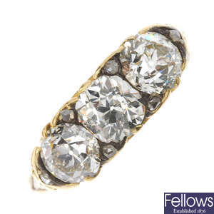 A late 19th century gold diamond three-stone ring.