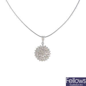 A diamond cluster pendant, with chain.