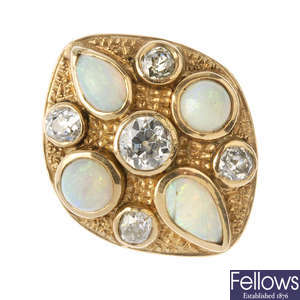 A diamond and opal dress ring. 