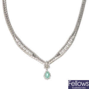 An emerald and diamond necklace. 