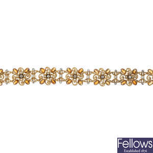 An 18ct gold diamond and gem-set bracelet.