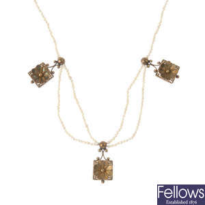 A late 19th century gold and seed pearl floral necklace.