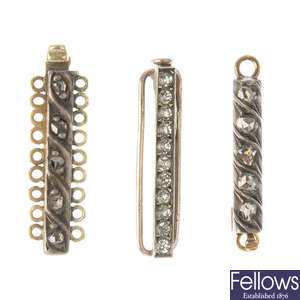 A selection of three diamond and paste clasps.