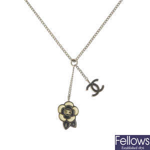CHANEL - an enamel 'Coco Camellia' pendant, with chain.