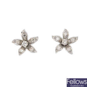 A pair of diamond floral ear studs.