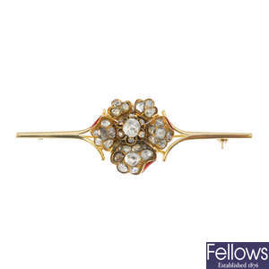 A foil-back diamond and enamel floral brooch.