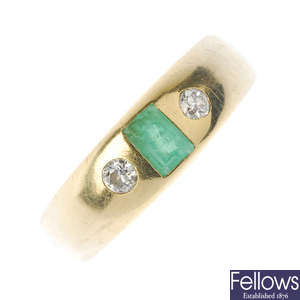 A gentleman's emerald and diamond ring.
