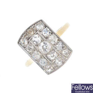An mid 20th century platinum and 18ct gold diamond dress ring.