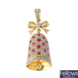 A diamond and ruby bell pendant.