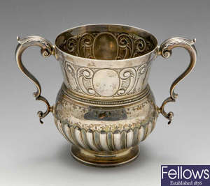 A late Victorian silver twin-handled cup.