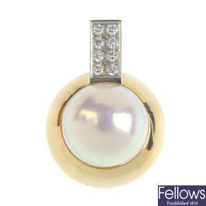 A mabe pearl and diamond pendant.