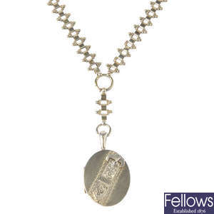 A late Victorian silver locket with collar.