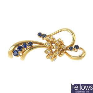 An 18ct gold sapphire and diamond floral brooch.