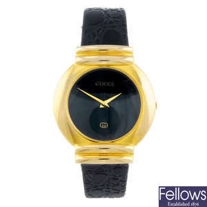 GUCCI - a gentleman's 5300M wrist watch together with a lady's Gucci 5300L and a gentleman's Krug-Baümen bracelet watch.