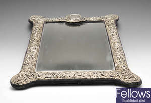 A large Edwardian silver mounted table mirror.