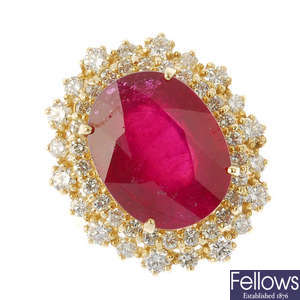 A glass-filled ruby and diamond cluster ring.