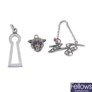A late Victorian diamond and gem-set fox head pendant and two further diamond pendants.