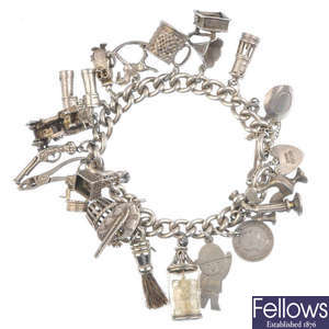 A charm bracelet and a locket and chain.