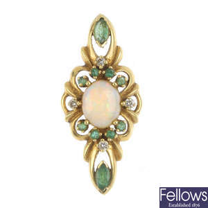 An 18ct gold opal emerald and diamond pendant.