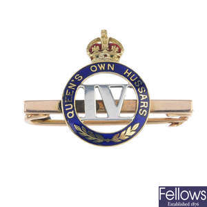 An early 20th century gold enamel Regimental badge, 4th Queens Own Huzzars.