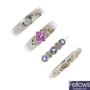 Four 9ct gold diamond and gem-set rings.
