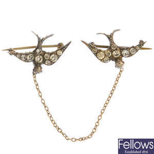 An early 20th century silver paste double bird brooch.
