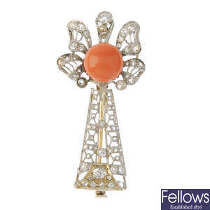 A coral and diamond brooch.