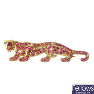 A 9ct gold ruby and diamond panther brooch.