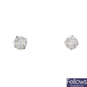 A pair of diamond single-stone ear studs.