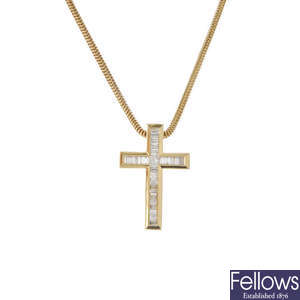 An 18ct gold diamond cross pendant, with chain.
