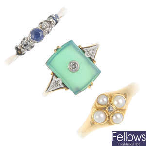 Three gem-set dress rings and a brooch.