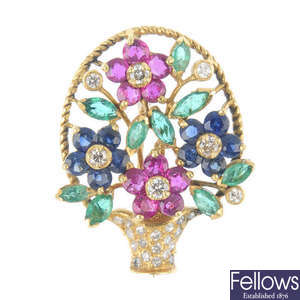 A 14ct gold diamond and gem-set floral pendant.
