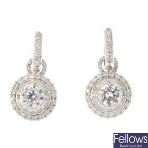 A pair of cubic zirconia and diamond earrings.