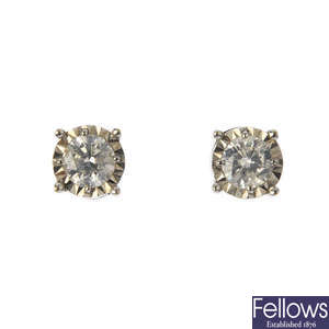 A pair of illusion-set brilliant-cut diamond ear studs.