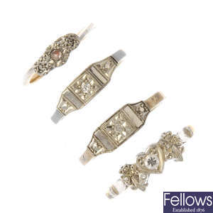 Four mid 20th century diamond dress rings.