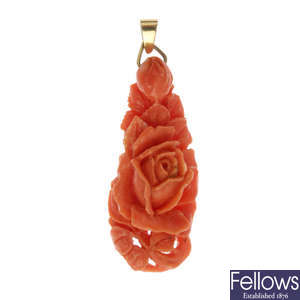 A carved coral pendant.